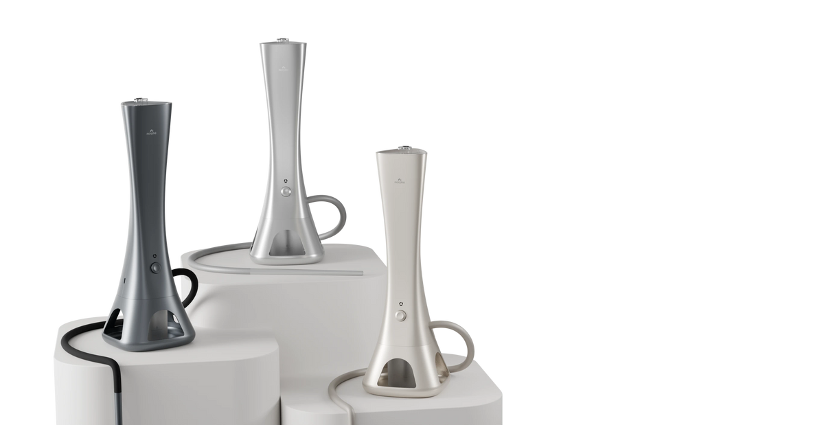 Dark grey, Silver and Champagne Norphé M1 electronic hookahs on display pedestals