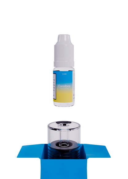 Caraïbos refill bottle above an empty Norphé pod in its open box
